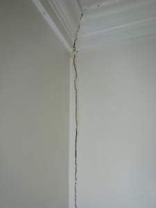 A crack in a corner of a wall.